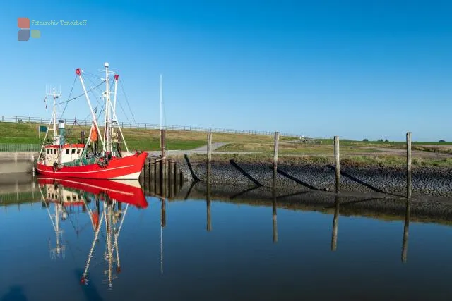 Red fishing boat in the southern harbor