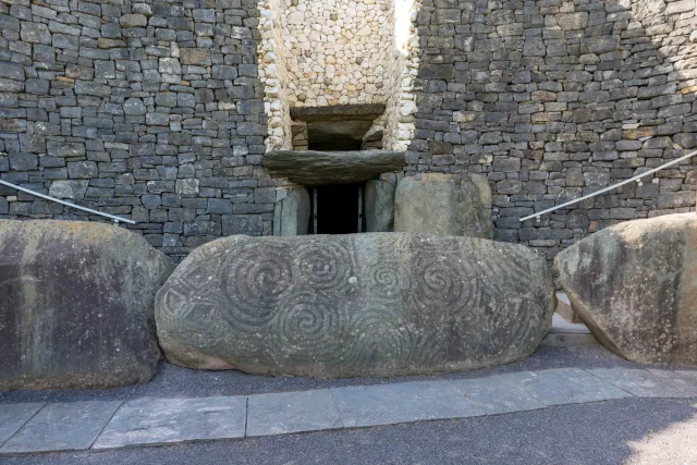 The entrance to the burial mound with decorated stone block