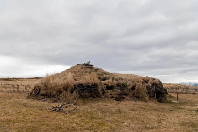 The reconstruction of a Sami coastal home inhabited by humans and domestic animals.